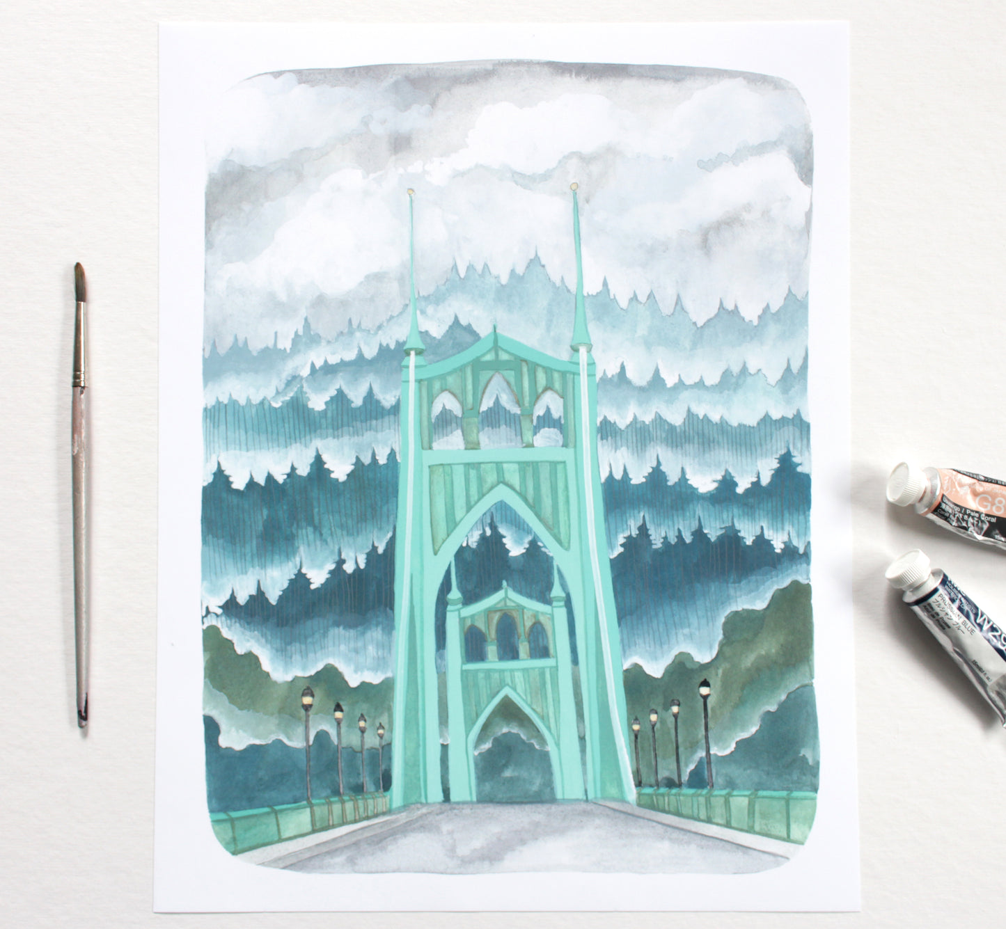 Watercolor painting of the St Johns Bridge with trees and clouds on a white background