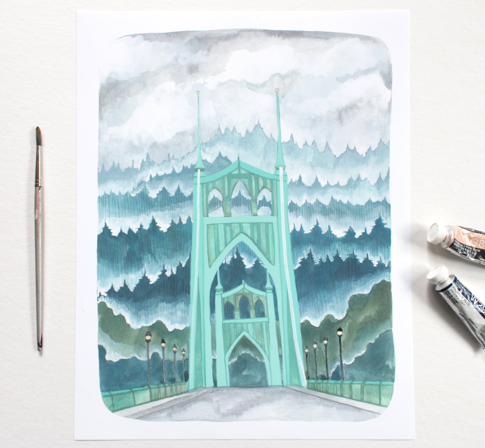 Watercolor painting of the St Johns Bridge with trees and clouds on a white background